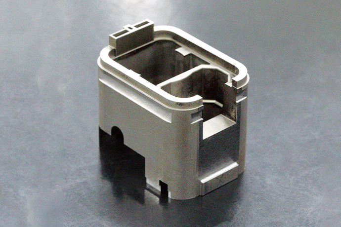 Sample of an injection mold die part. Wire machining and electrical discharge machining have been used for its production.